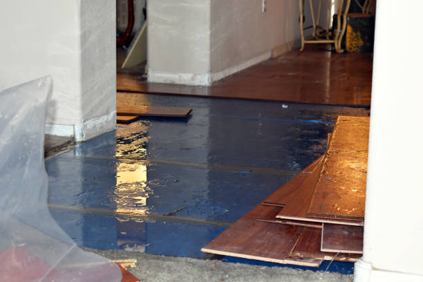 Professional Flood Damage Restoration technician working in West Hyannisport, MA